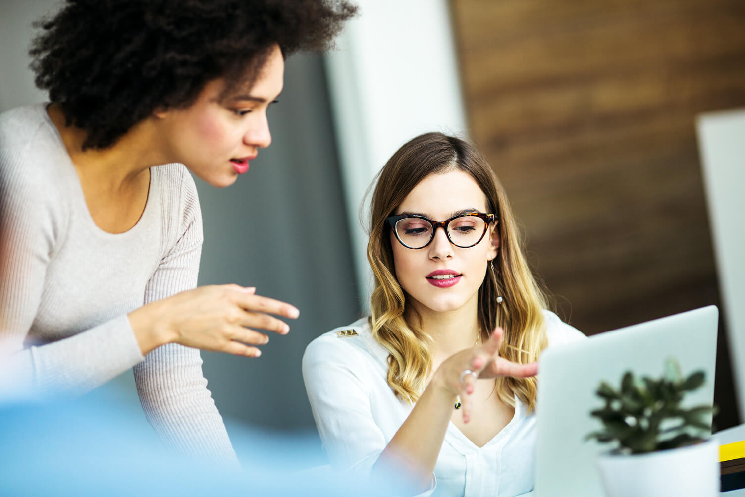 Women collaboration in front of a laptop